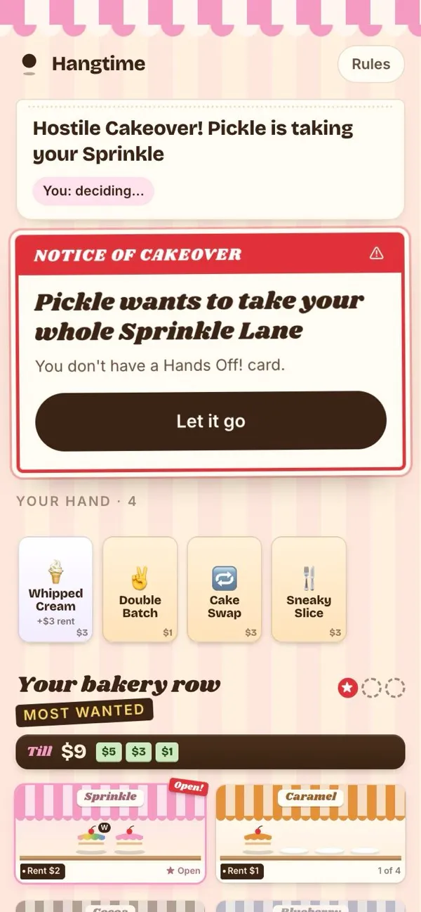 A phone showing a Notice of Cakeover: another player wants to take a whole street, with the player's hand of cards below
