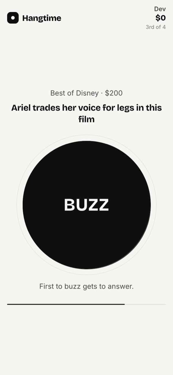 A phone showing the clue and a big BUZZ button